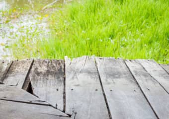 Top of Dock that is in need of repair with broken dried out boards