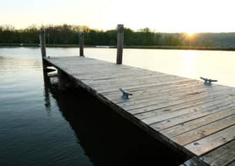 Newly built dock, all new wood structure, new flotation pontoons, topped off with new boards and cleat tie downs